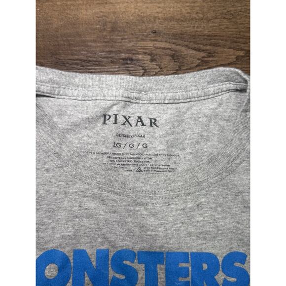 Disney Pixar Monsters Inc Mens Large Grey We Scare Because We Care Graphic Tee - Picture 4 of 5